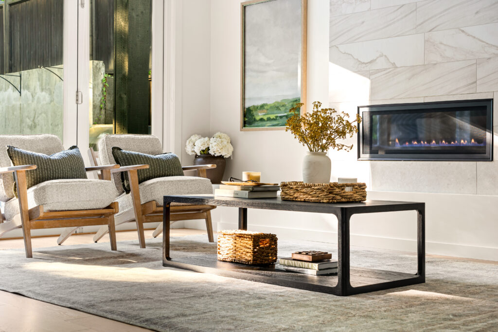 Stunning home staging, Abbotsford sellers will love featuring warm tones and chairs with green pillows